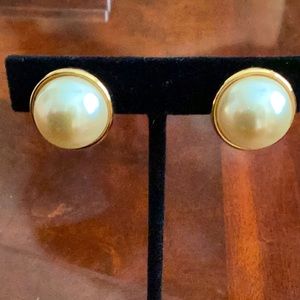 Pearl earrings with gold plated backing and closure clip on signed KJL.